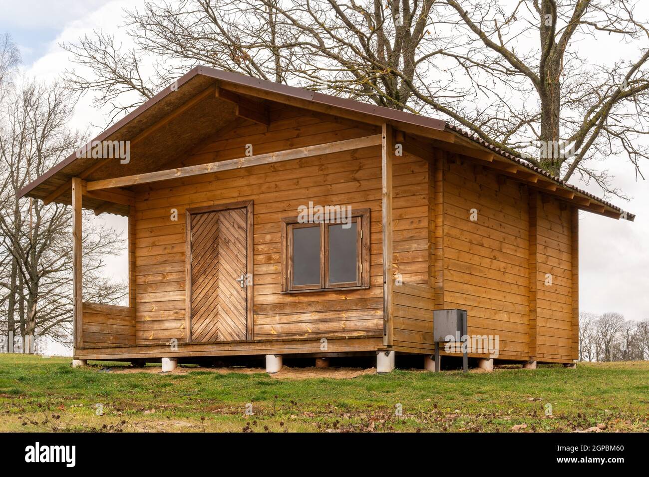 Small wooden house in the countryside during autumn season Stock Photo Alamy