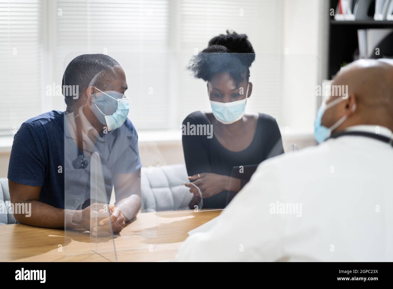 Couple Patient At Doctor With Pregnancy Lab Test Results Stock Photo