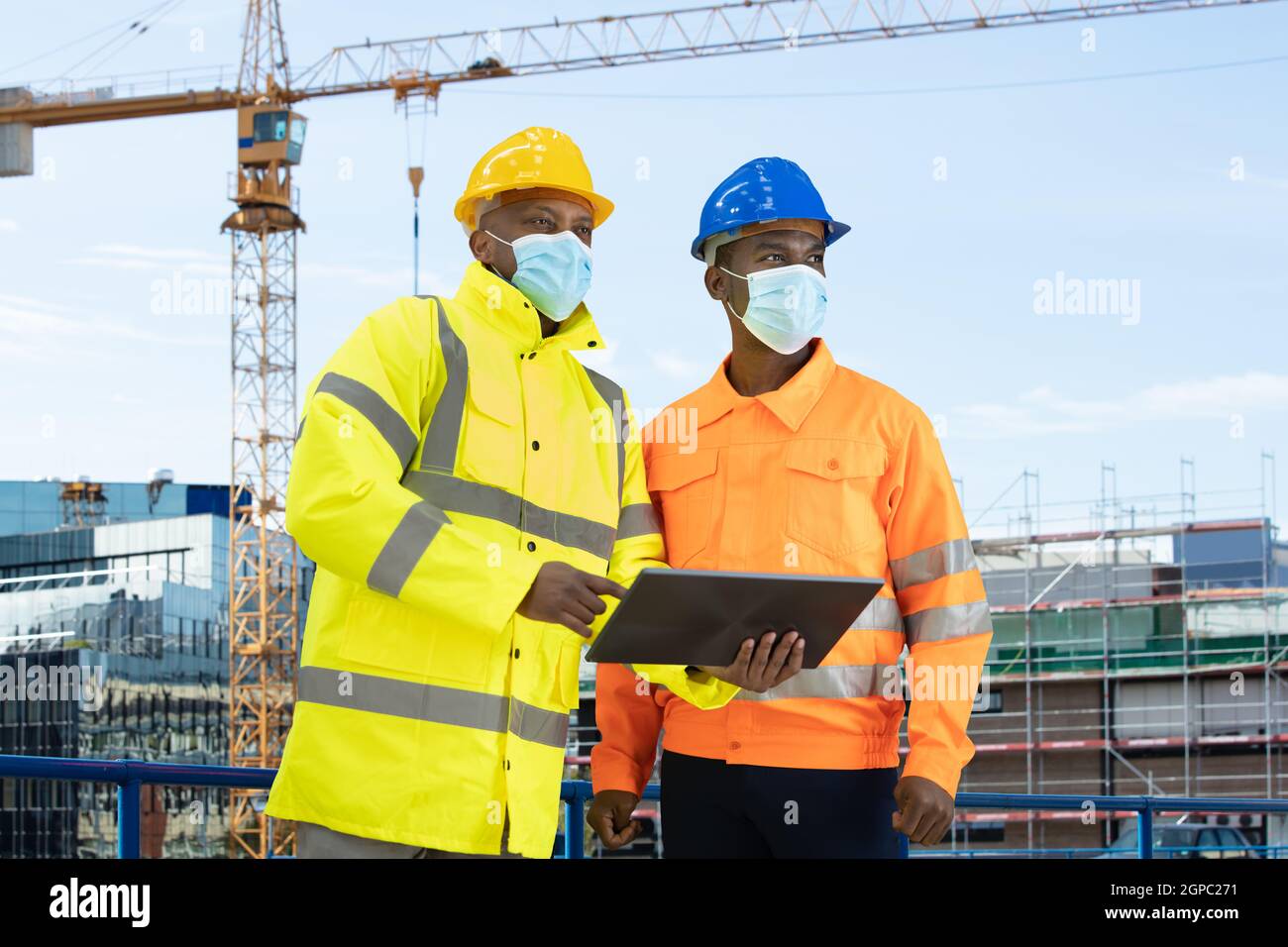 Construction Site Engineer And Building Inspection Pointing Stock Photo