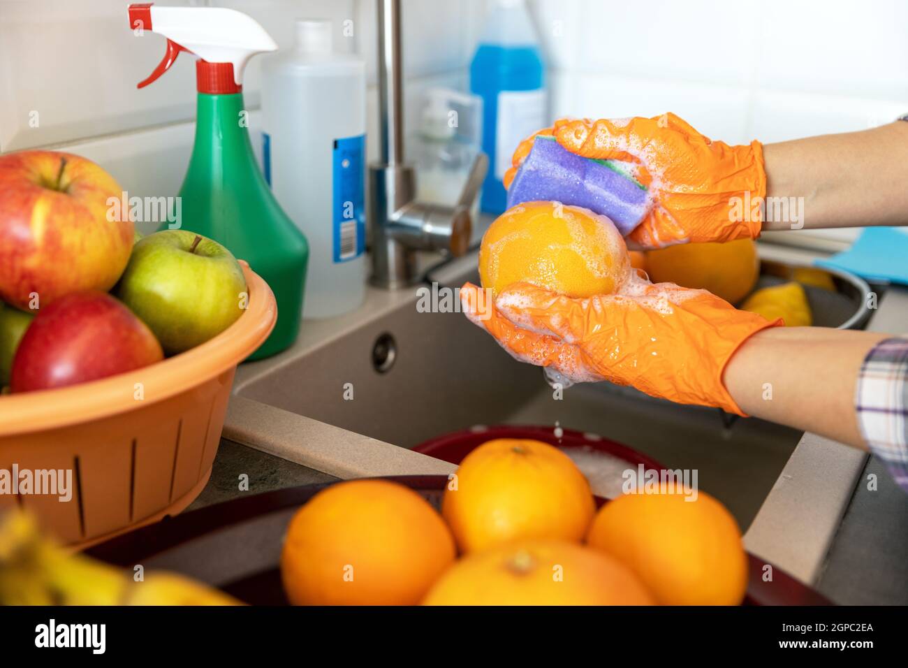 Washing grapefruit in the kitchen with water and soap Stock Photo Alamy