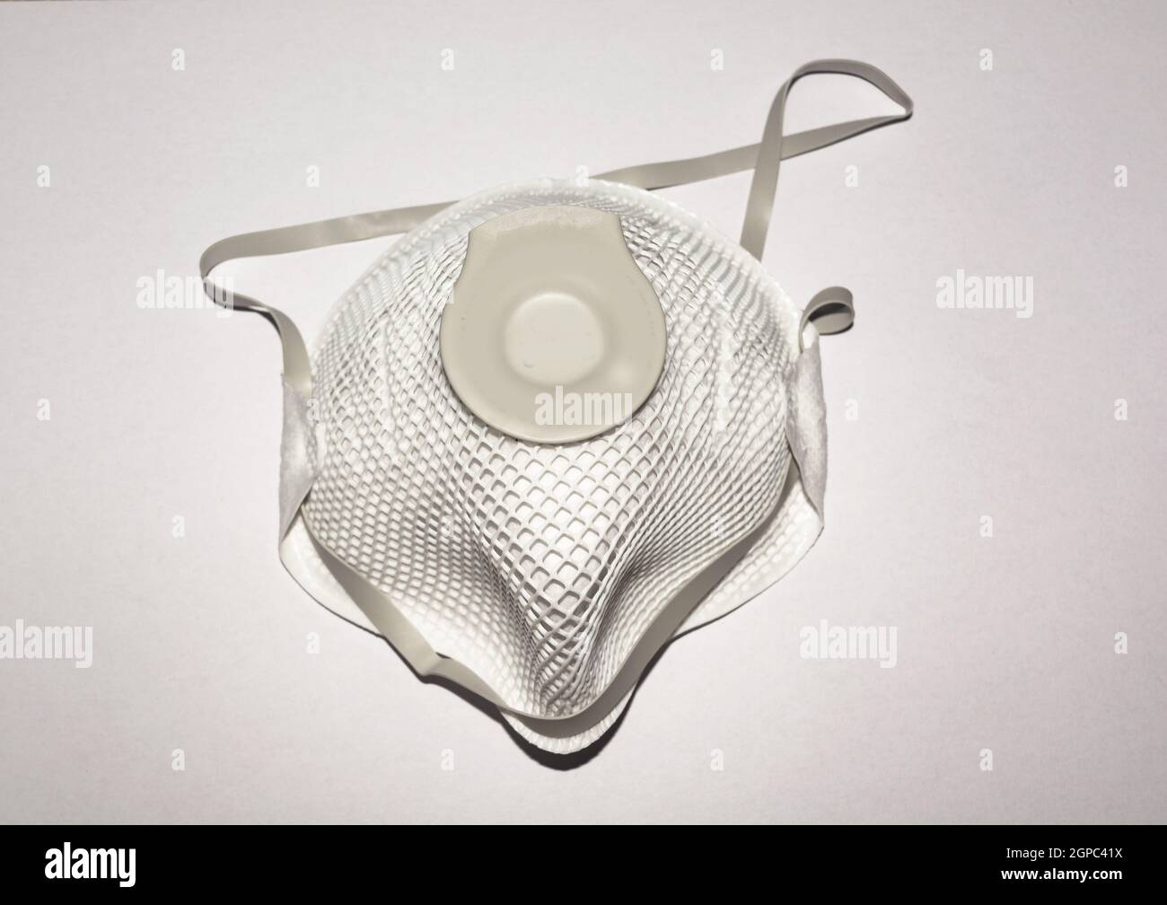 View of Disposable Respirator Mask FFP3, FFP2. Protection against Covid-19, particles, gases. Fine dust medical mask FFP 3 with breathing valve Stock Photo
