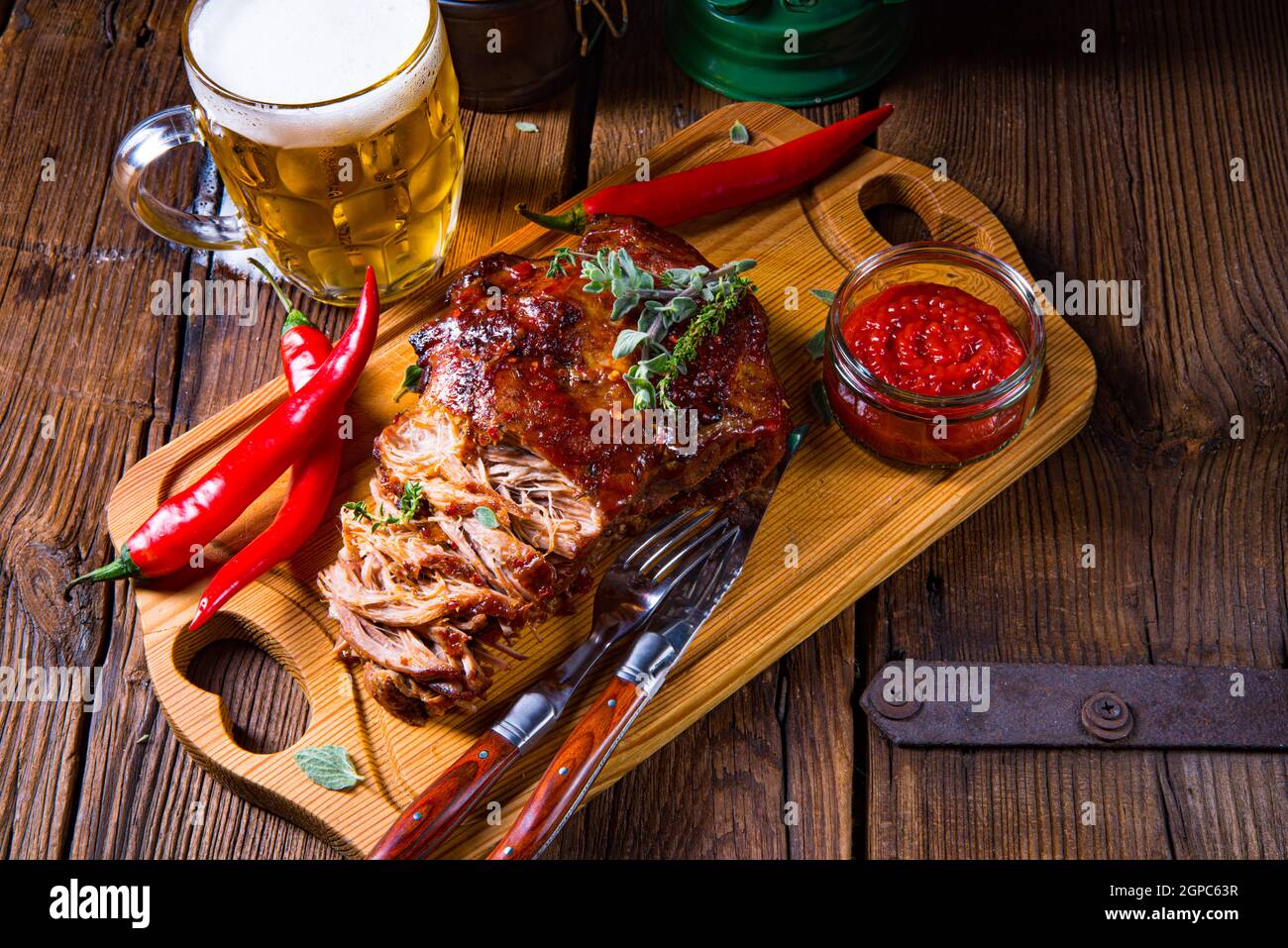 Pulled pork out of the oven with beer sauce Stock Photo Alamy