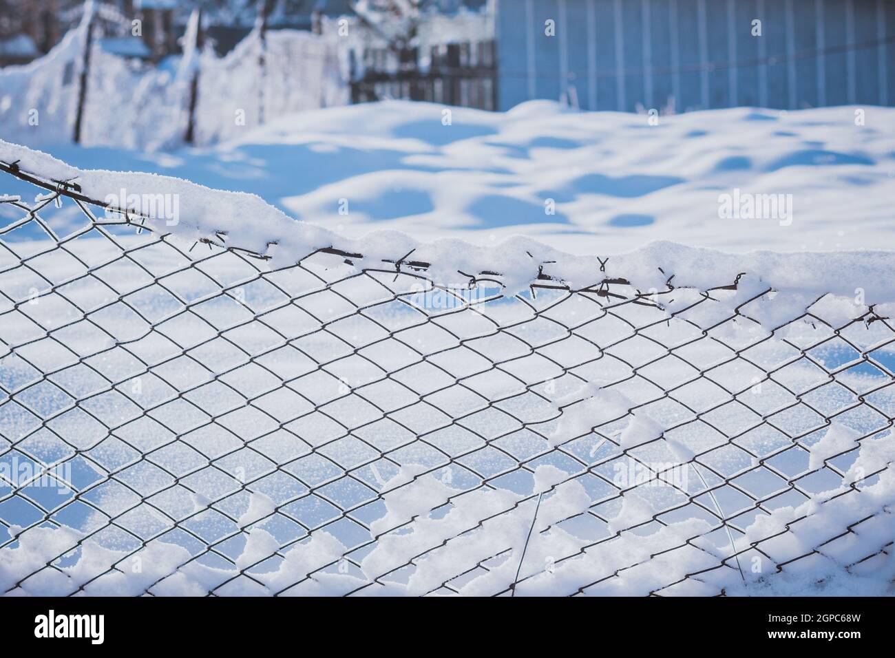 Fence covered in snow during winter Stock Photo - Alamy