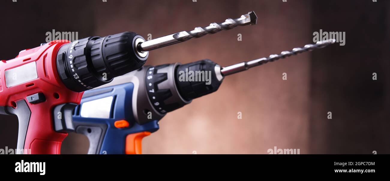 Composition with two cordless drills also working as screw guns Stock Photo