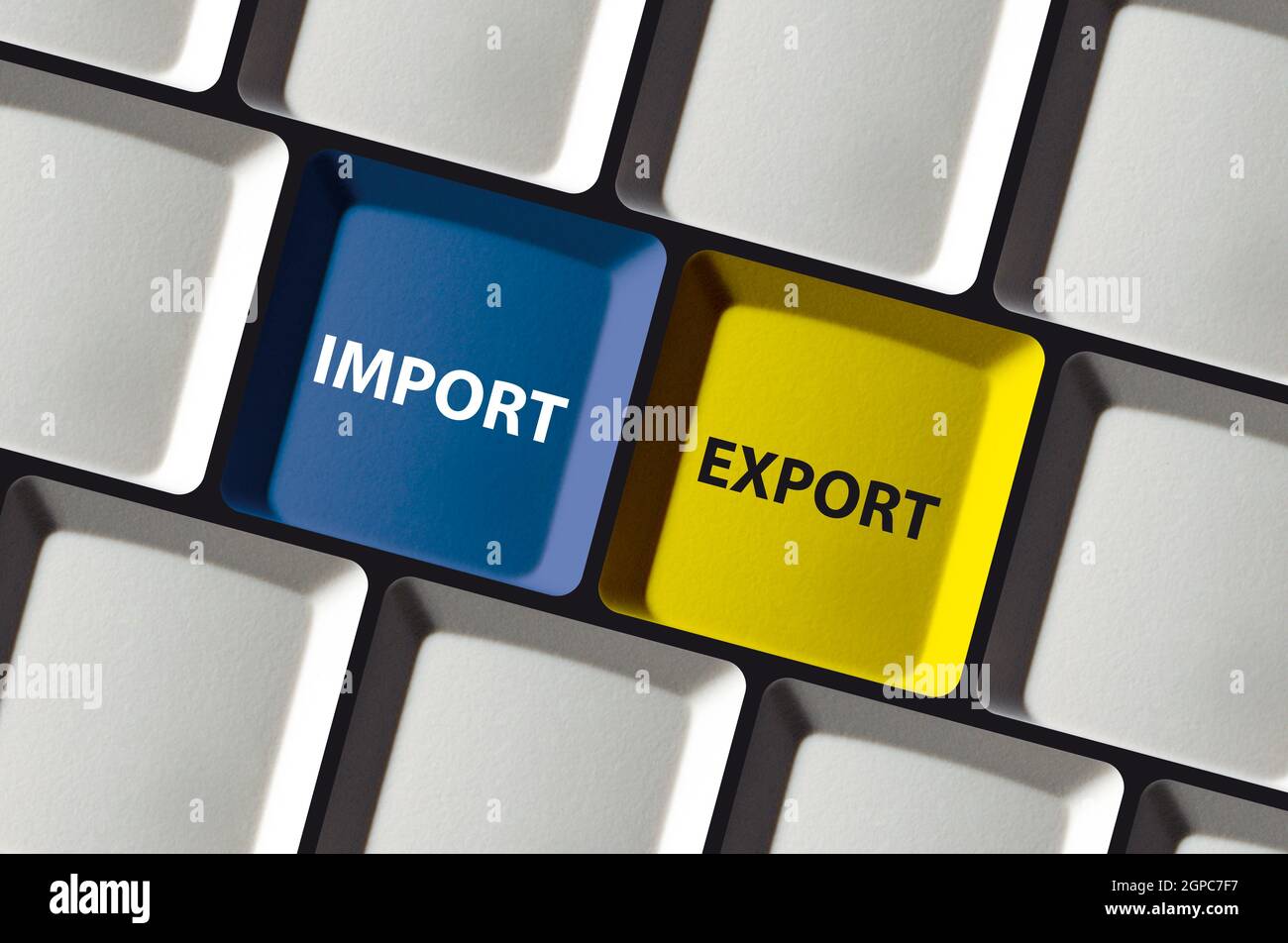 Import export buttons on colored computer keyboard e-commerce trade Stock Photo