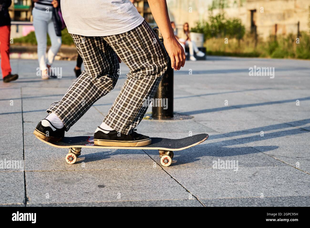 Skateboarder ride on skateboard at city street. Scater practice skate board  tricks at skatepark. Teenager extreme sport Stock Photo - Alamy