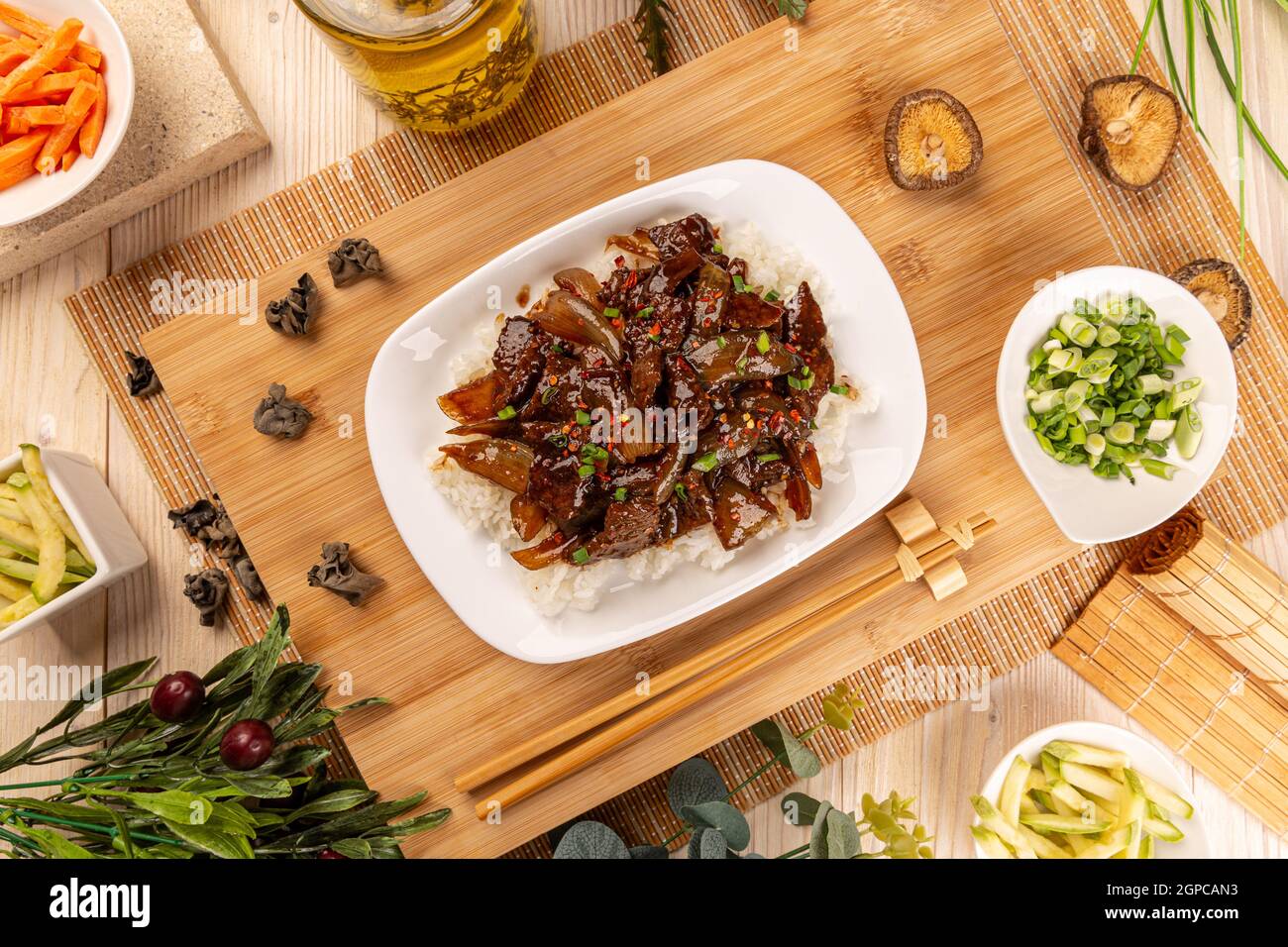 Flat lay of spicy beef and bamboo shoots served with boiled rice