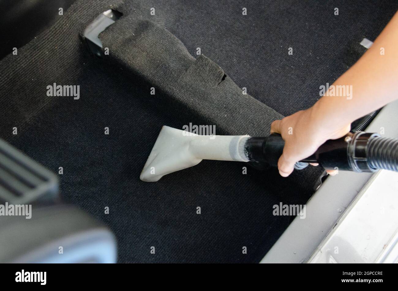 Wash the car carpet.Detailing on interior of modern car.Vacuum and