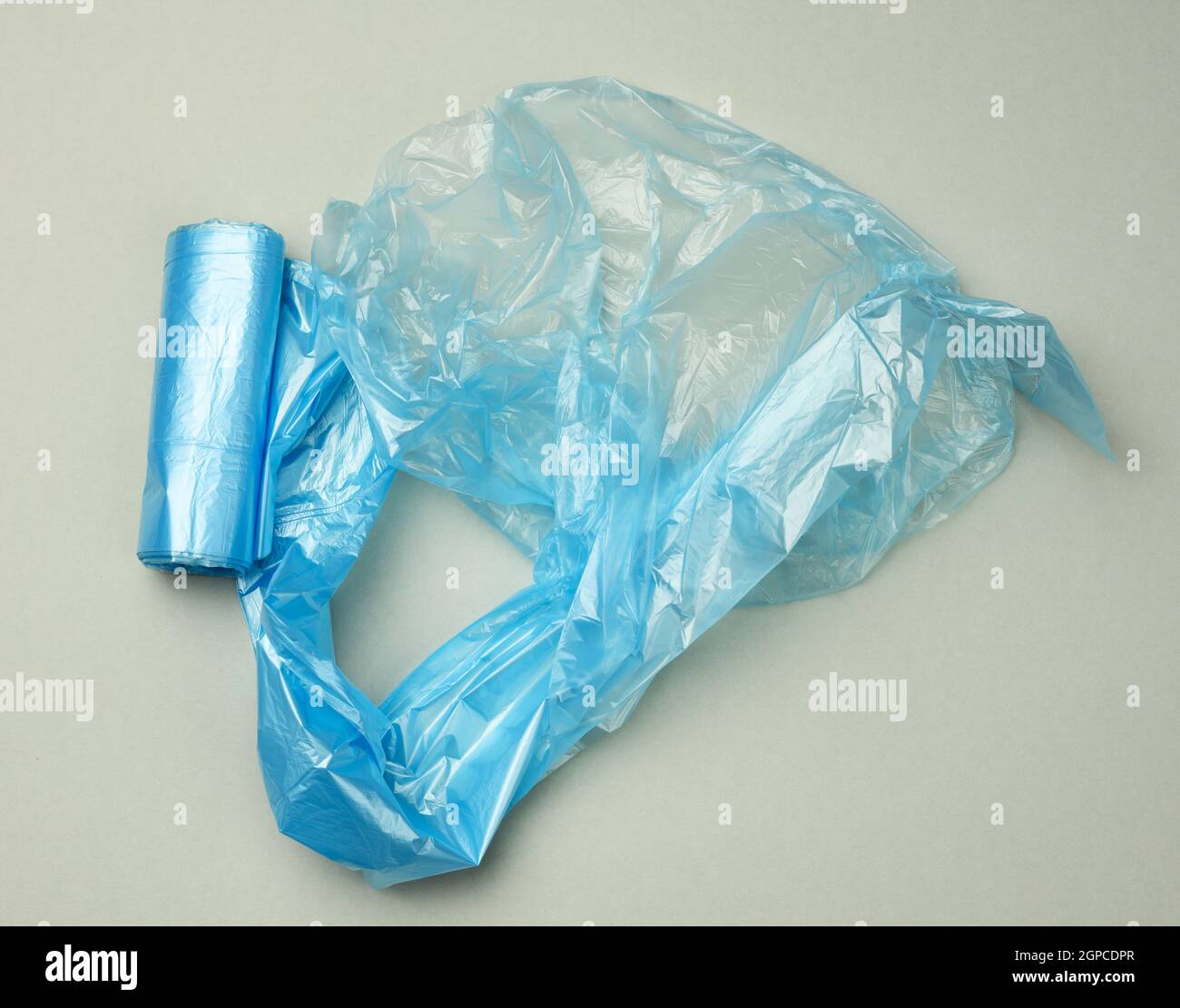 twisted blue plastic bags for bin on a gray background, top view Stock ...