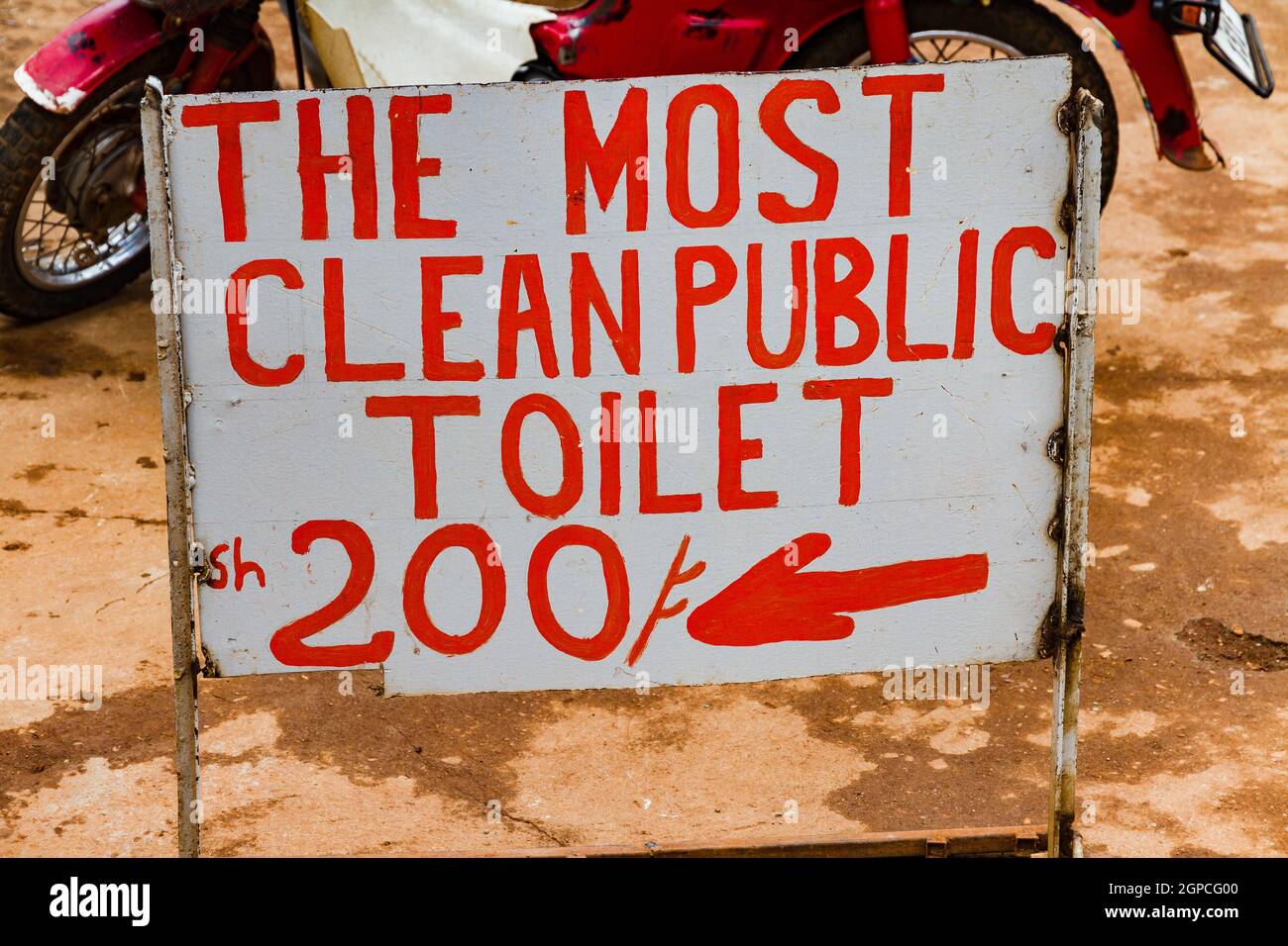A sign pointing the way to a clean toilet in Africa Stock Photo Alamy
