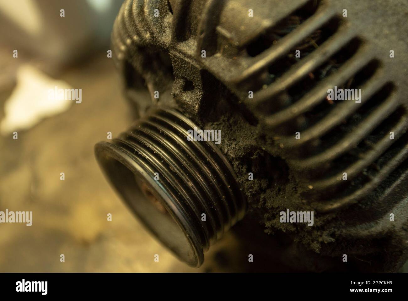 Old worn alternator of the car to be replaced Stock Photo