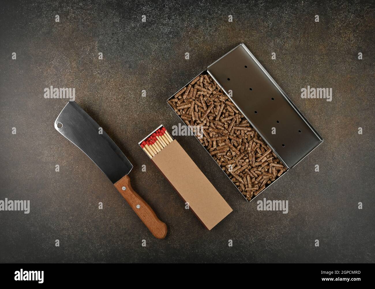 Close up one stainless steel metal smoker box with hardwood pellets