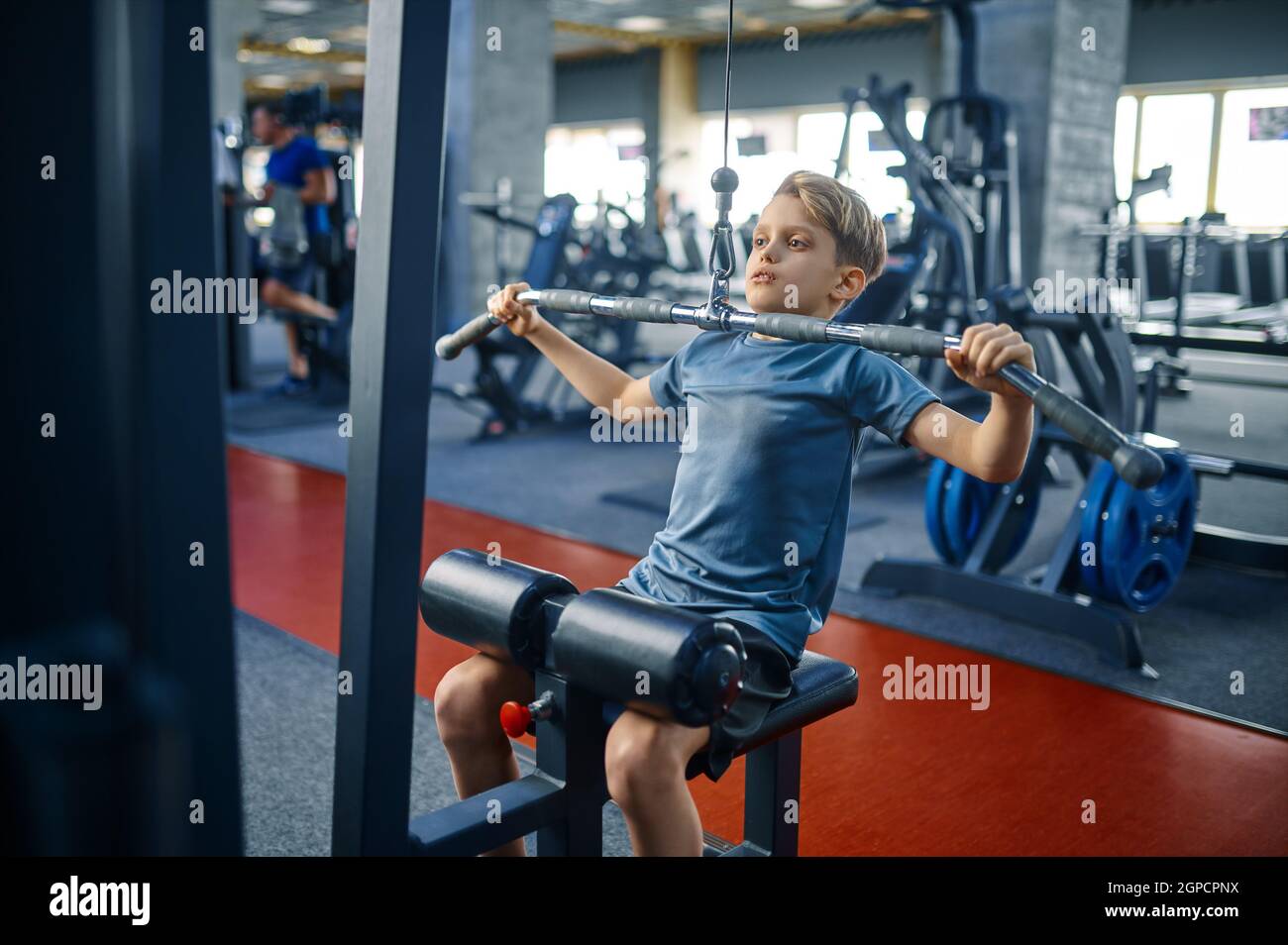 Boy on exercise machine, training in gym. Youngster in sport club,  healthcare and healthy lifestyle, schoolboy on workout, sportive youth  Stock Photo - Alamy