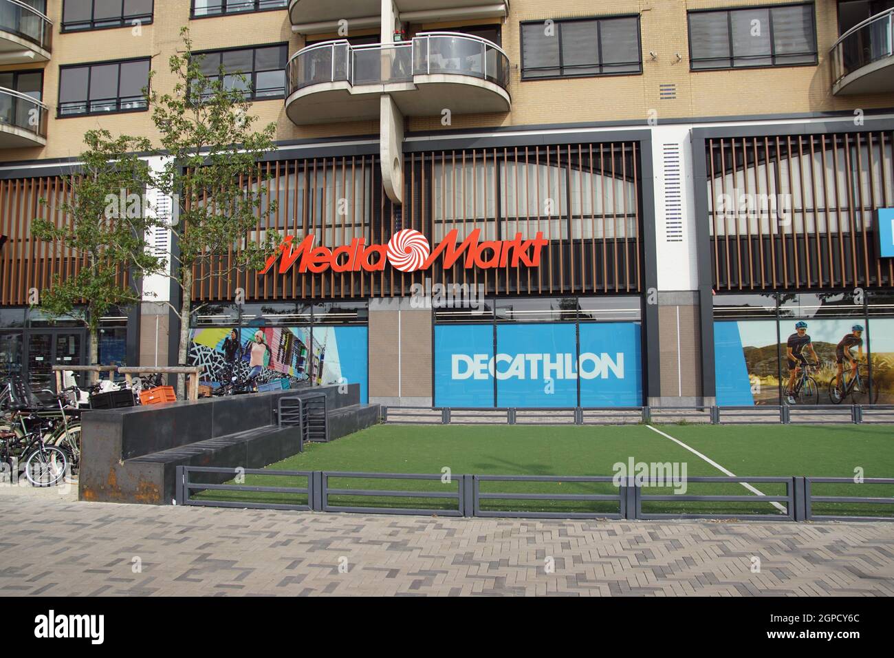 Dutch shops Media Markt, MediaMarkt and Decathlon,apartments above and a  football field with artificial grass in front. Alkmaar, Netherlands  September Stock Photo - Alamy