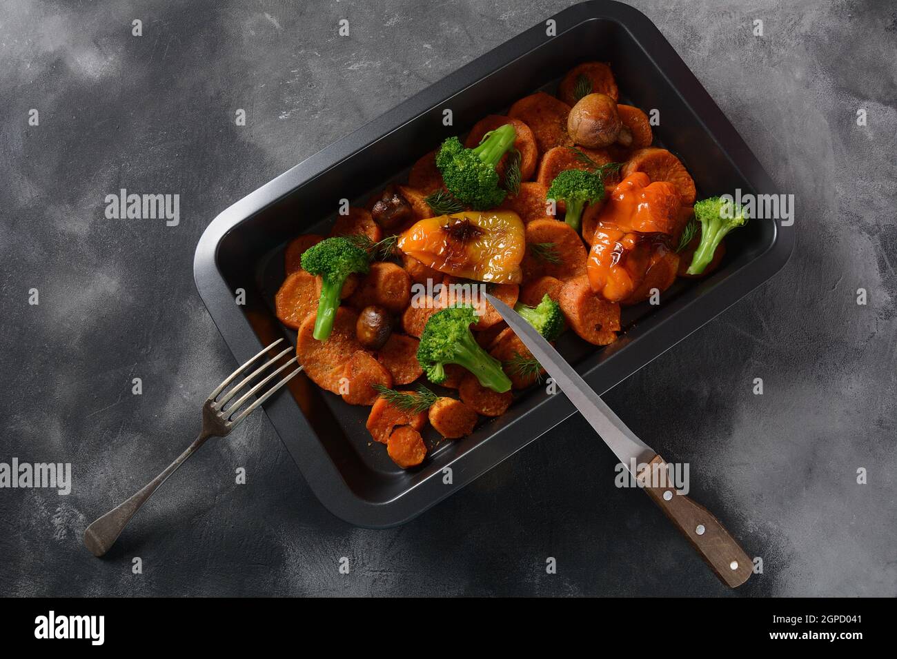 Homemade baked orange sweet potato slices , sweet yellow bell pepper