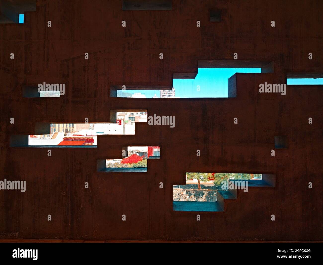 A wall covered with rust film and barshaped recesses, like the