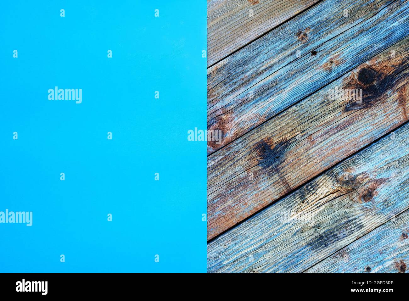 Light blue cardstock on an old wooden table in antiqued pastel colors