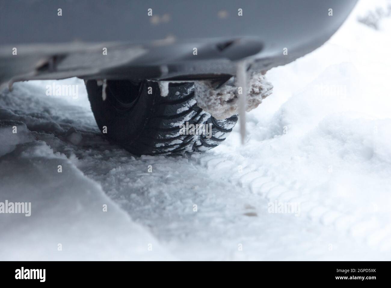 Closeup of car tire in winter on the road covered with snow Stock Photo ...