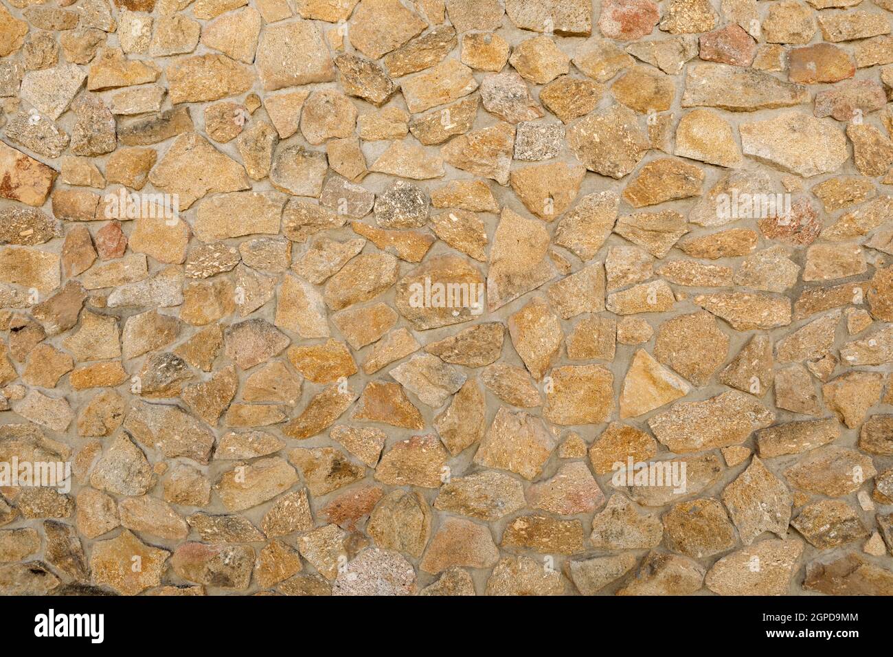 Brown stone wall to use as wallpaper Stock Photo - Alamy