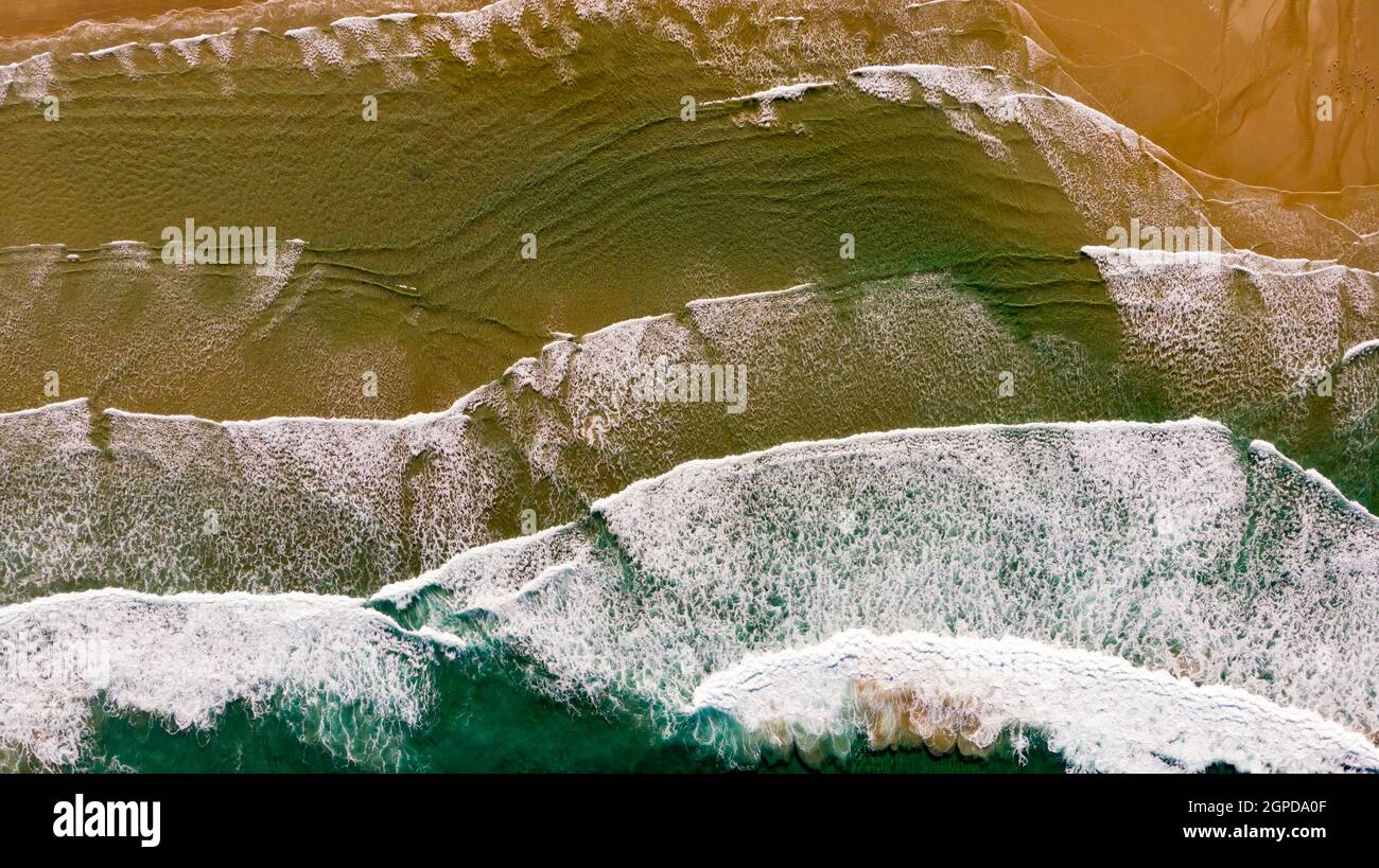 Beautiful aerial view of a beach with waves. Natural textures and colors Stock Photo