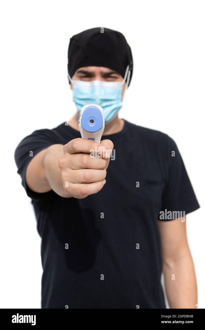 Doctor taking temperature with infrared thermometer Stock Photo Alamy