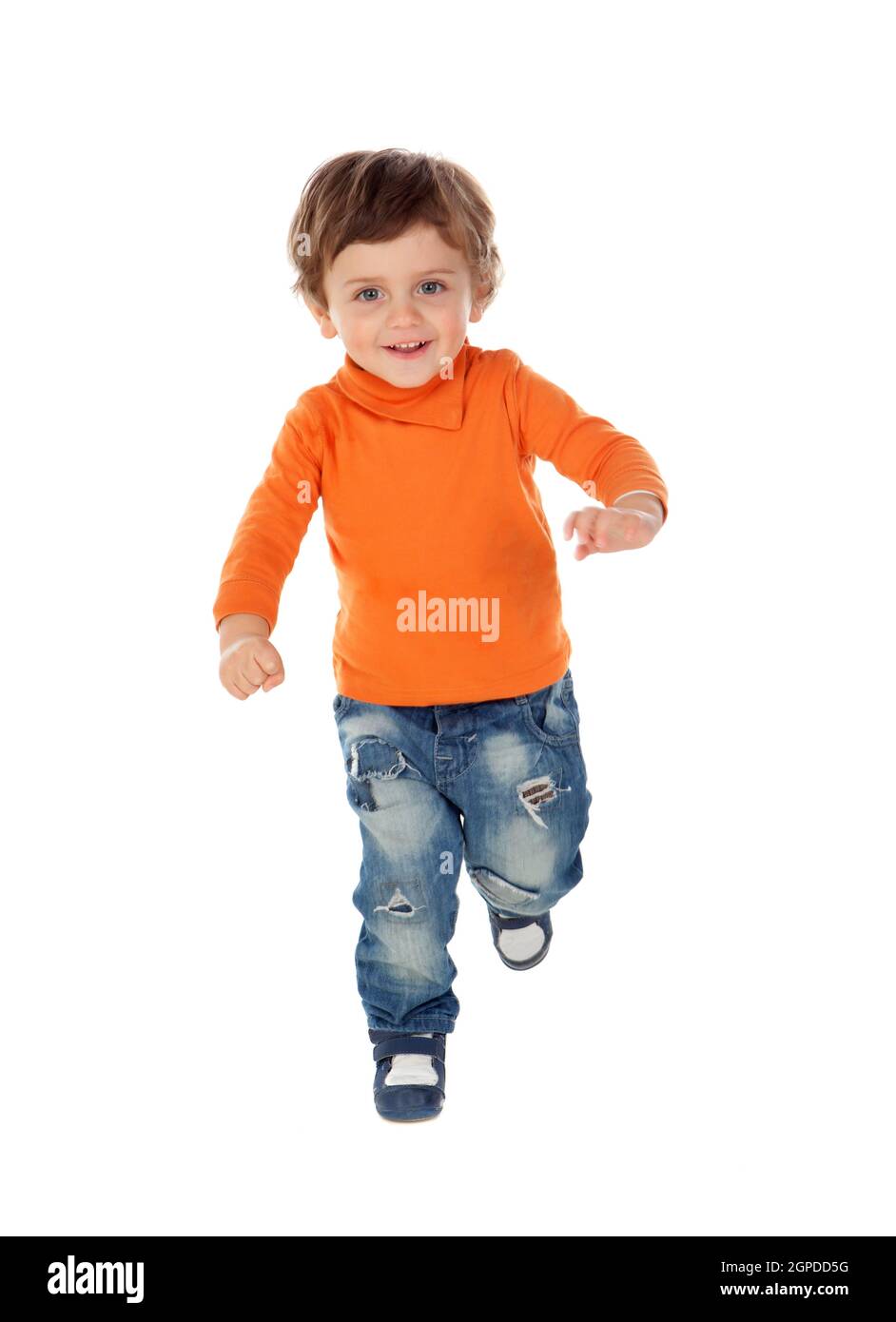 Beautiful little child two years old wearing jeans and orange jersey