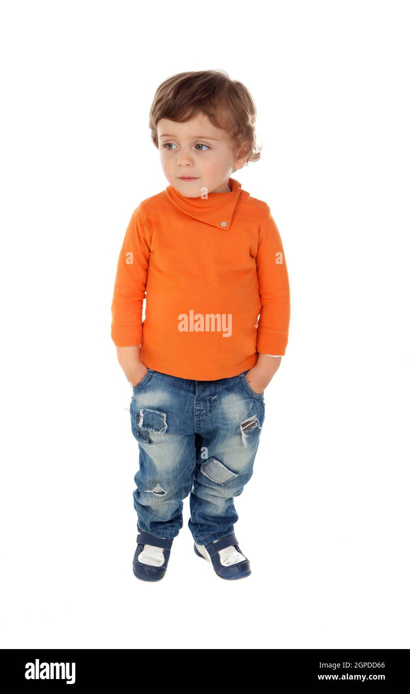 Beautiful little child two years old wearing jeans and orange jersey