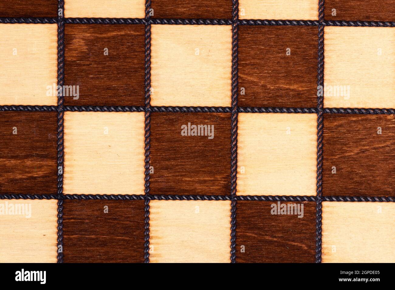 Wooden chessboard close up for background Stock Photo