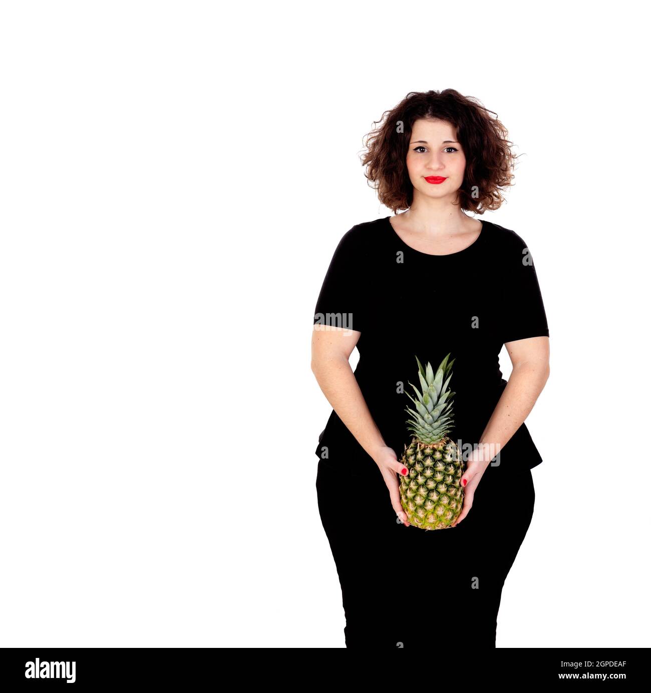 Beautiful curvy girl holding and pineapple isolated on a white background Stock Photo