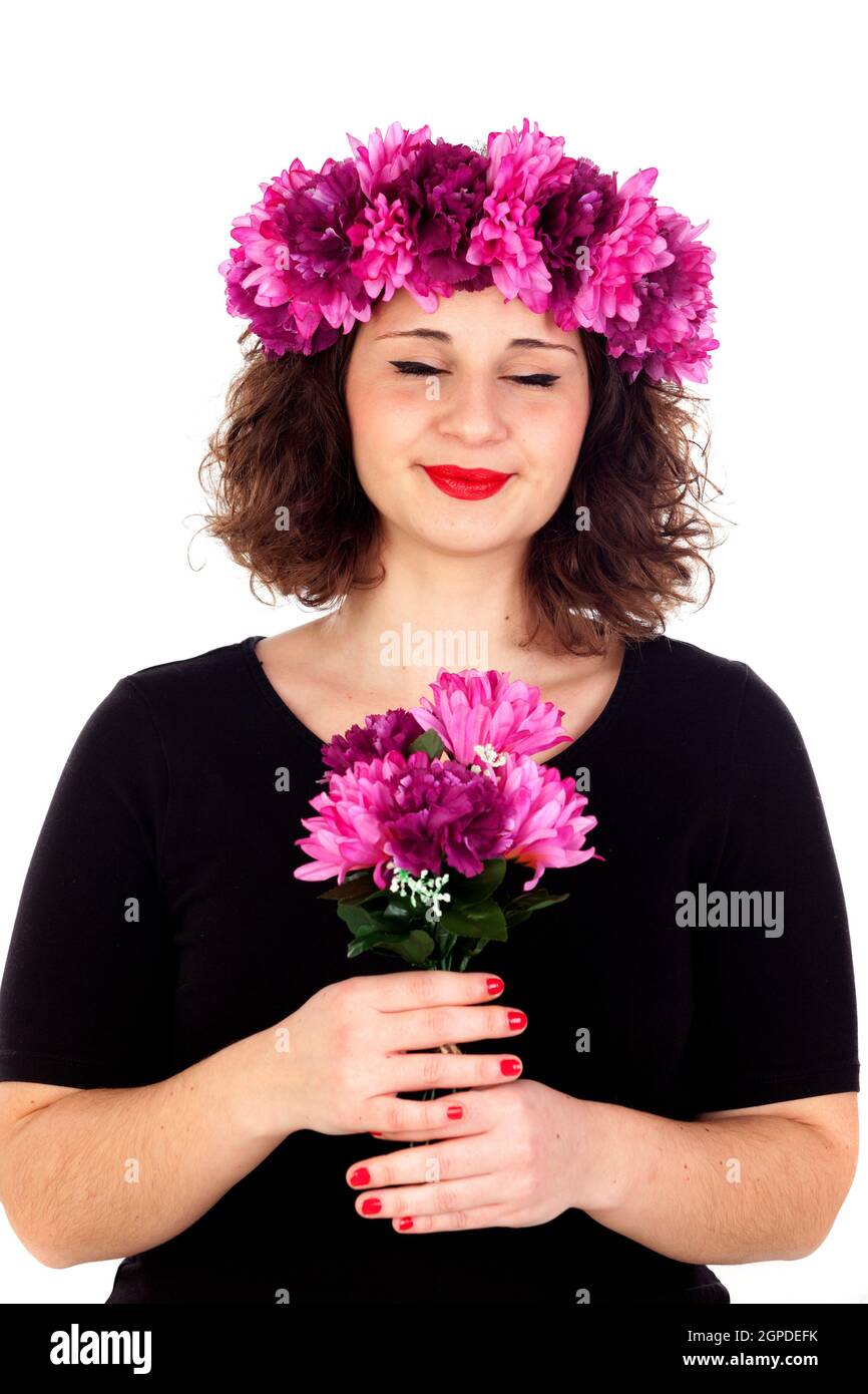 Happy girl with a branch and crown with pink and purple flowers isolated on a white background Stock Photo