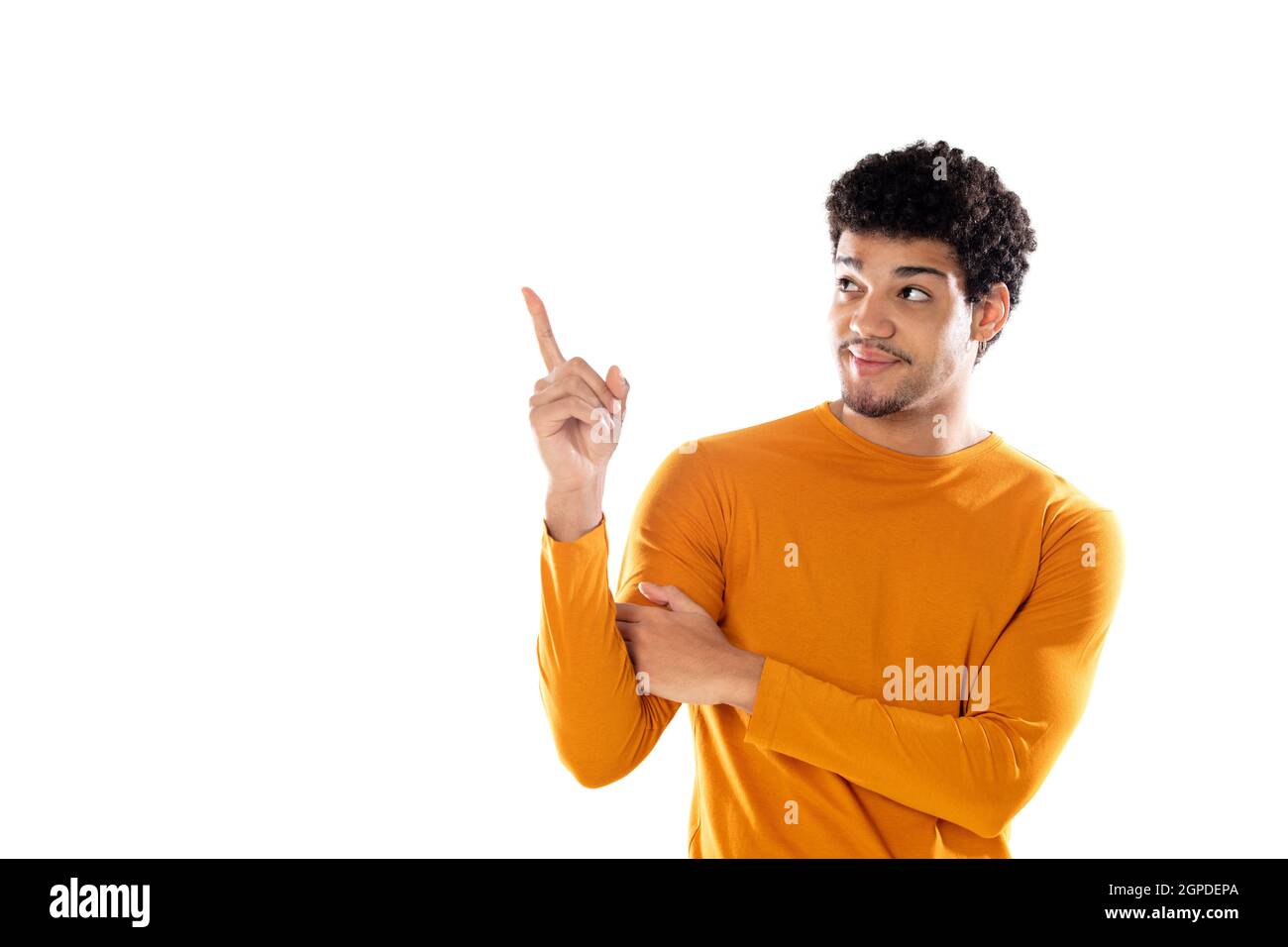 Young black afro guy laughing and pointing to something with his finger ...