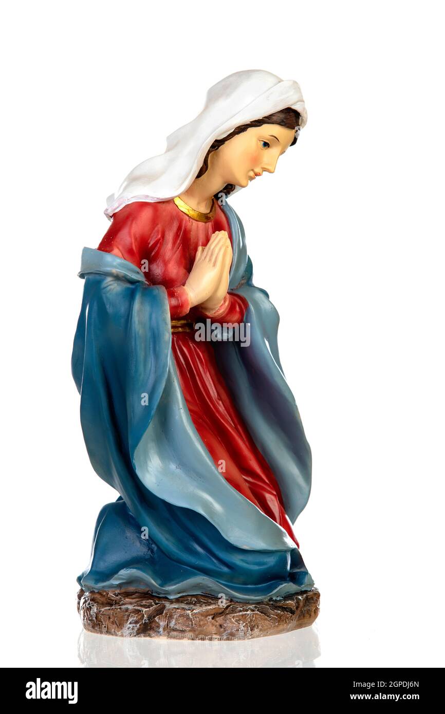 Ceramic figure of the virgin mary isolated on white background Stock