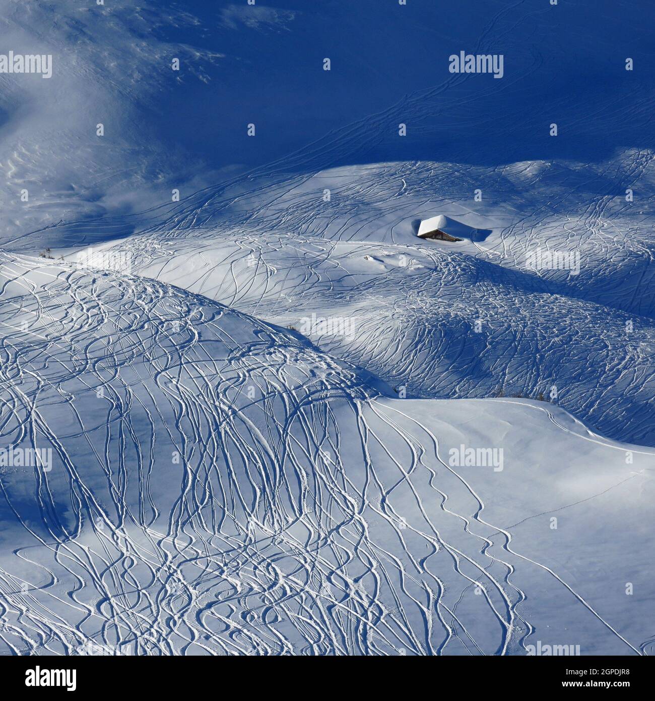 Ski and snowboard tracks and little hut Stock Photo Alamy