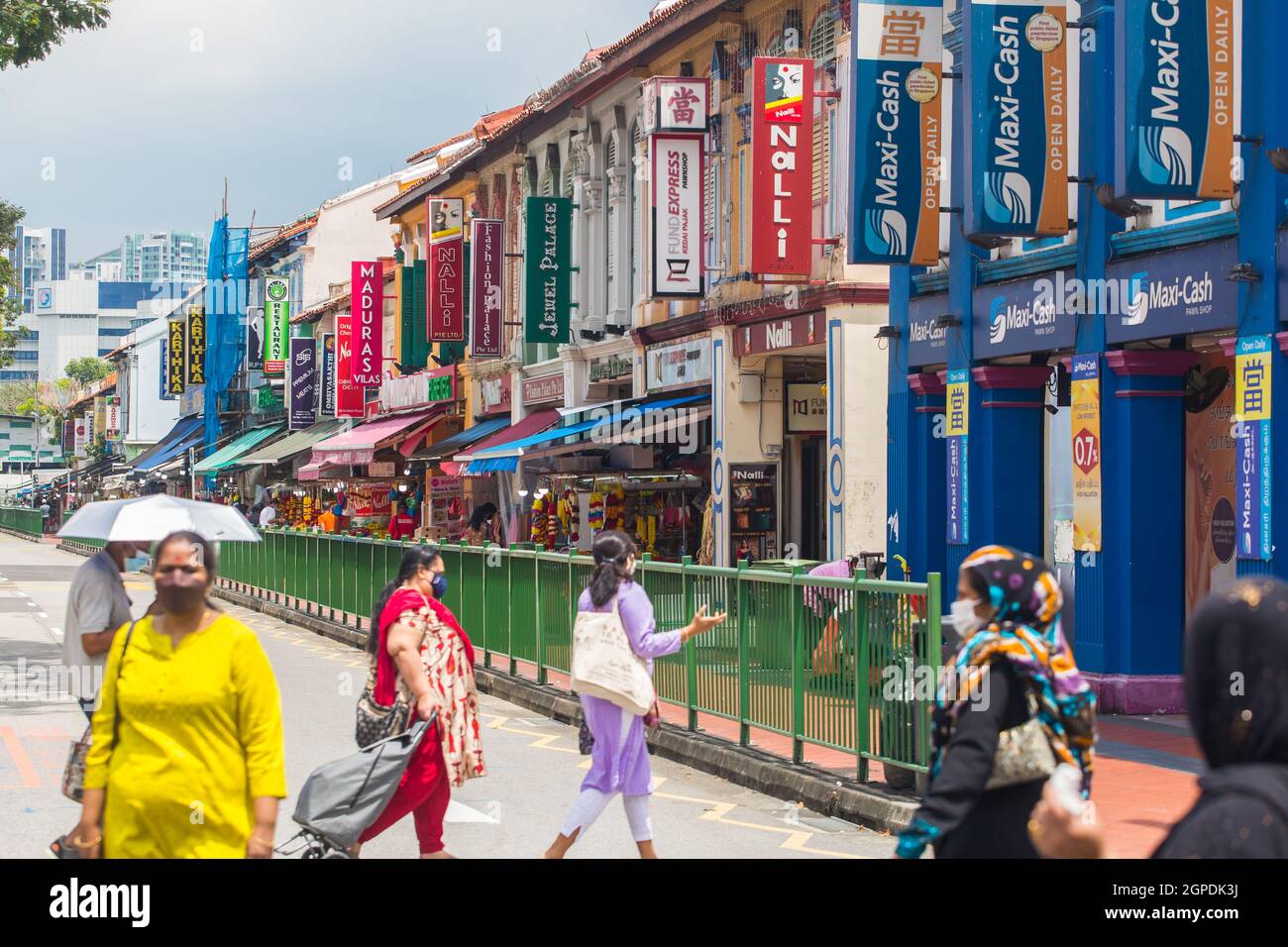 Row of shophouses and people action at Little India. Singapore. Stock Photo