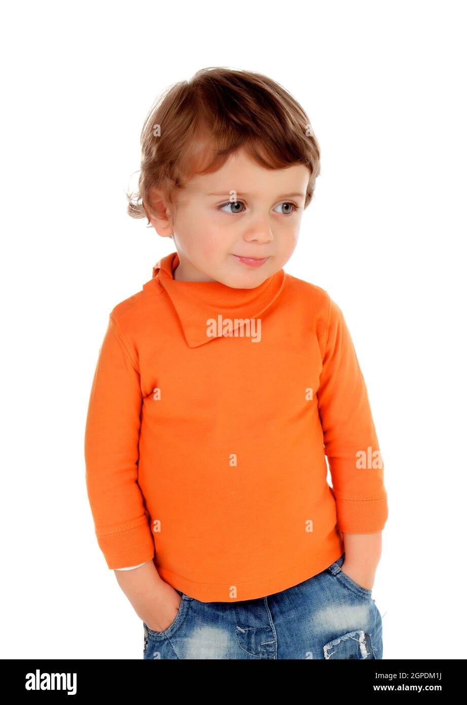 Beautiful little child two years old wearing jeans and orange jersey