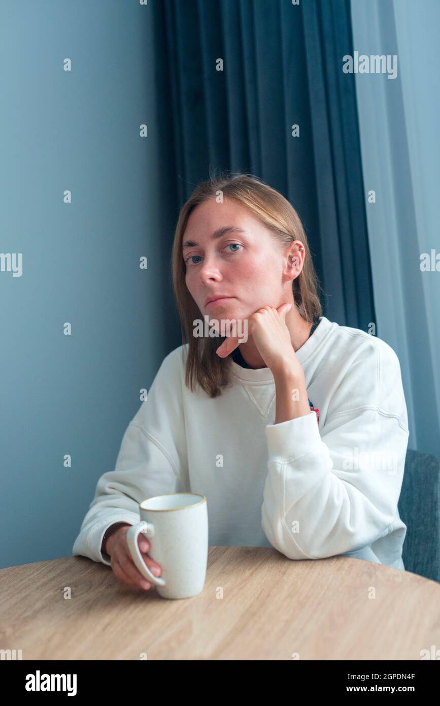 Young woman holding cup released Stock Photo