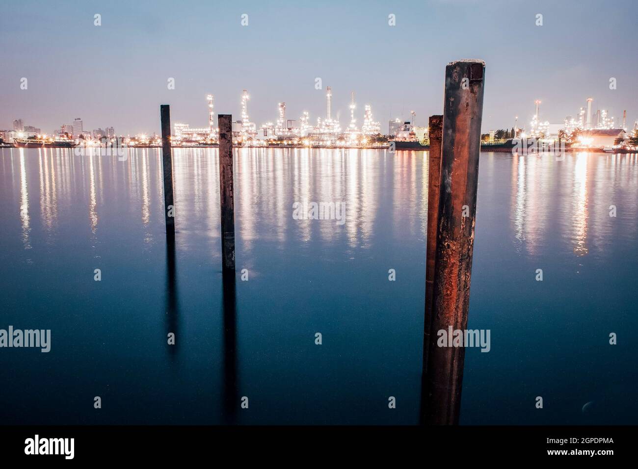 Cityscape at night and reflection in the river. Town Lake mirrored ...