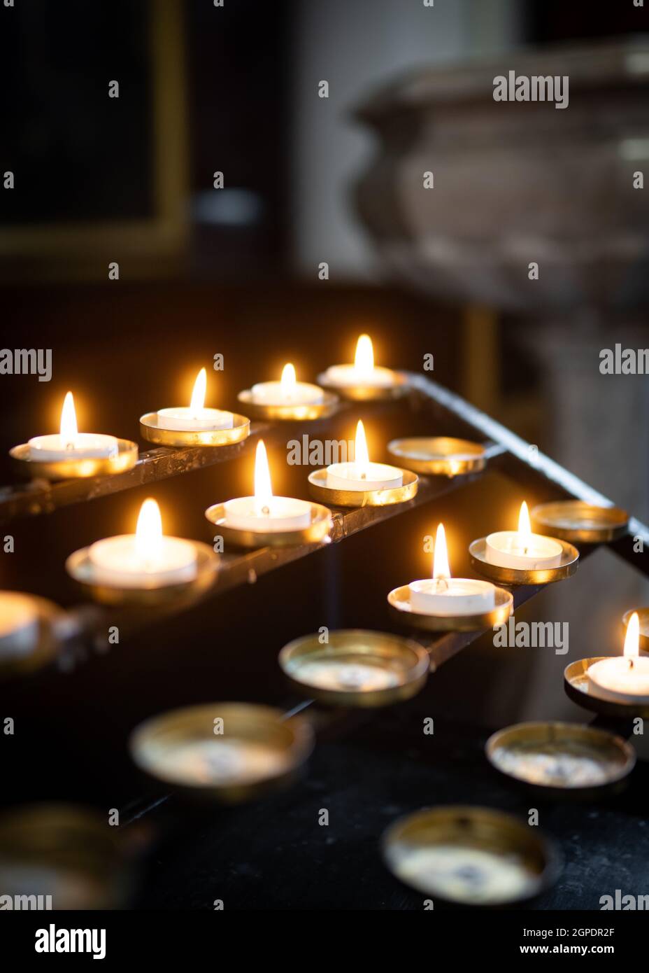 Candle of remembrance burning light and bright in church. Flame and