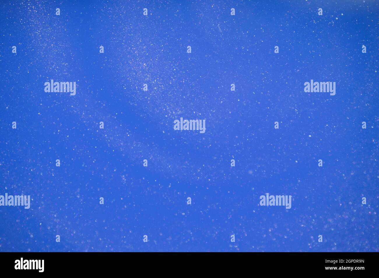 Blue glitter abstract background. Glamorous blue glittering magical bright festive background for New Year's party decor. High quality photo Stock Photo