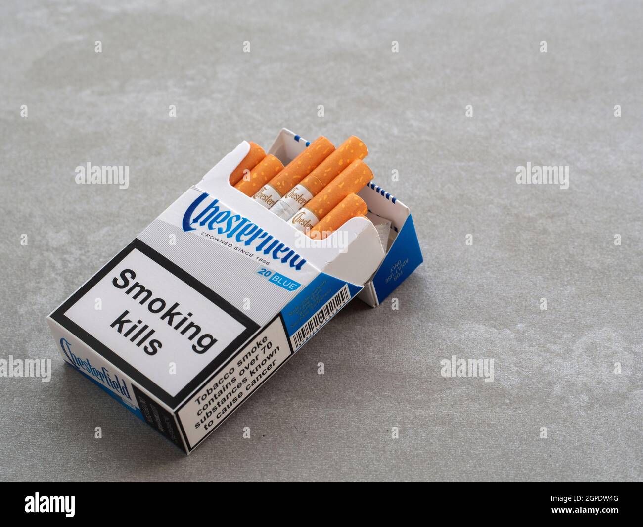 In this photo illustration, a pack of Chesterfield Cigarettes, made by  Philip Morris with a government warning 'Smoking Kills' seen displayed  Stock Photo