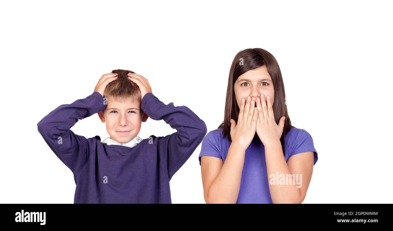 Children covering the ears and shocked by a loud sound isolated on a