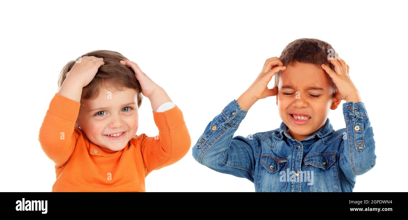 Children covering the ears and shocked by a loud sound isolated on a