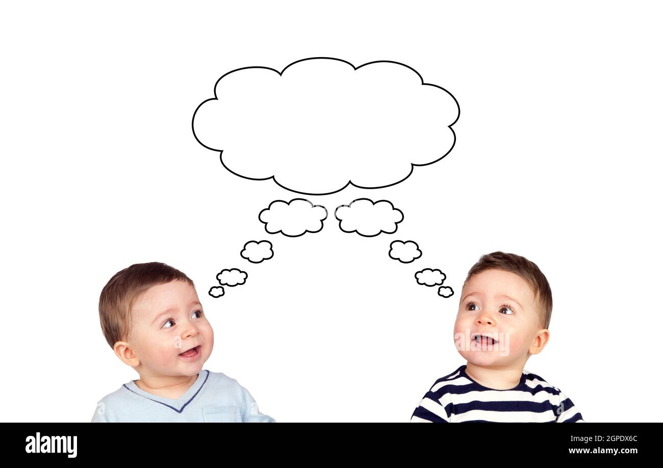 Pensive two twins children looking up isolated on a white backround Stock Photo