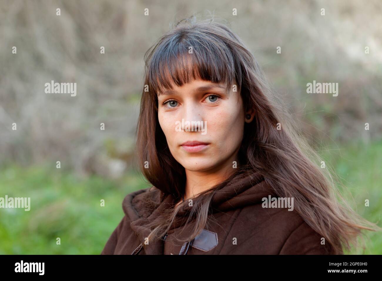 Beautiful woman with blue eyes in the park Stock Photo Alamy