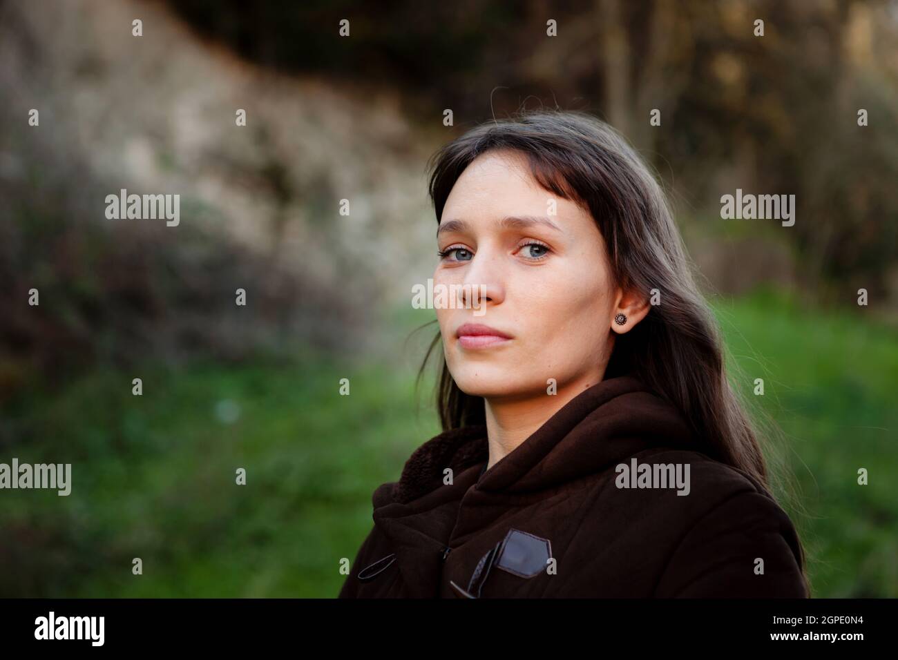 Beautiful woman with blue eyes in the park Stock Photo Alamy