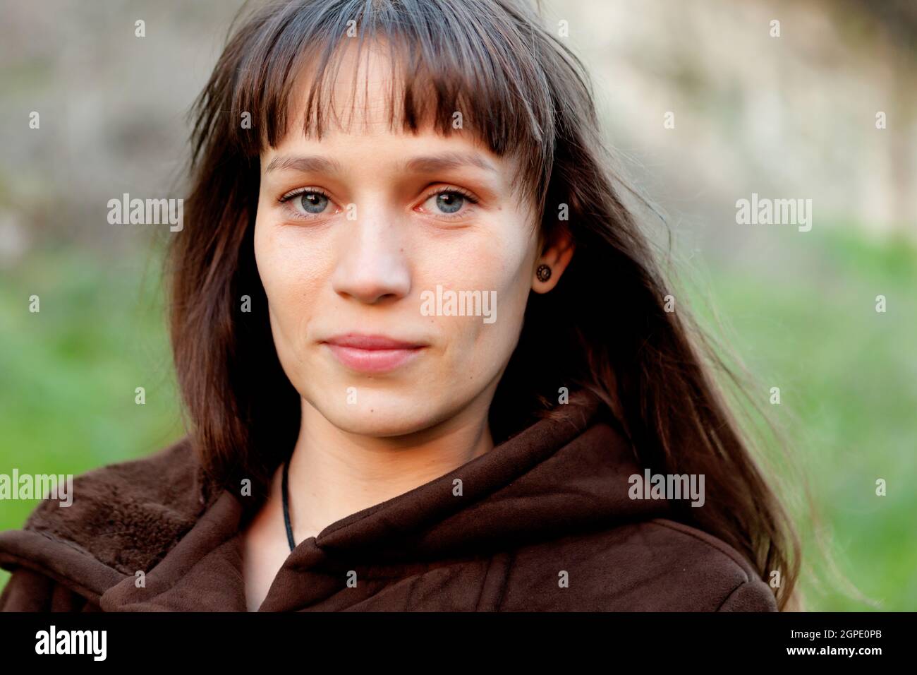 Beautiful woman with blue eyes in the park Stock Photo Alamy