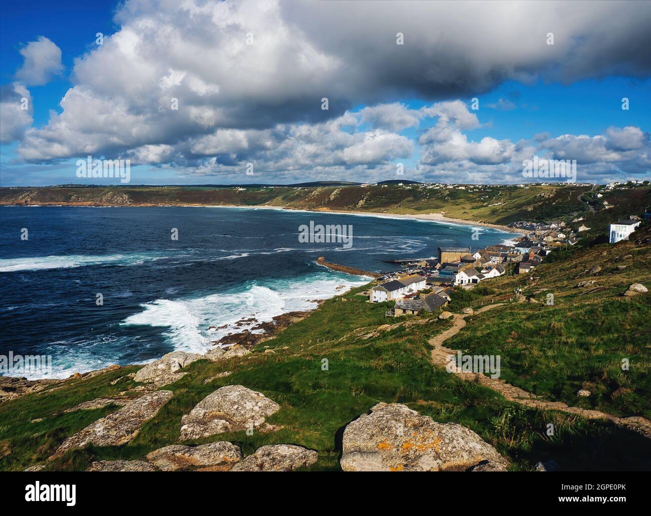 Looking from Mayon Cliff Lookout point as the South West Coastal Path drops into Sennen Cove, curving around to Sennen Beach and Gwynver Beach. Stock Photo