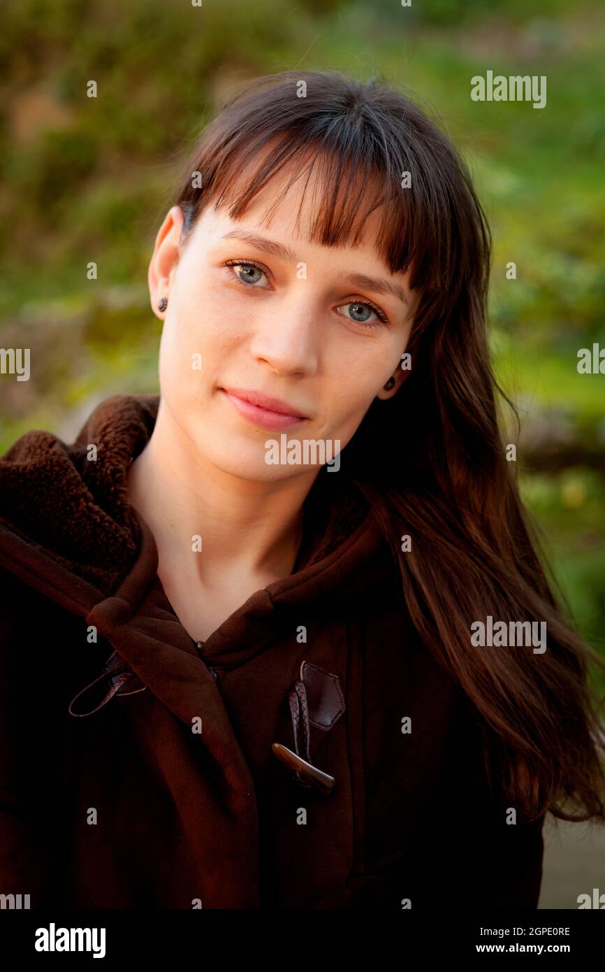 Beautiful woman with blue eyes in the park Stock Photo Alamy