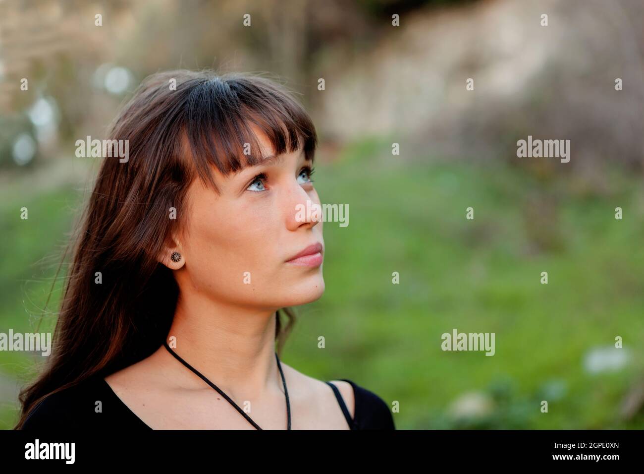 Beautiful woman with blue eyes in the park Stock Photo Alamy