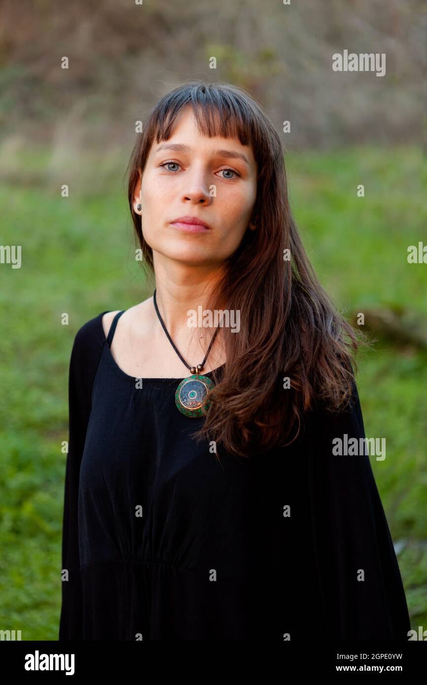 Beautiful woman with blue eyes in the park Stock Photo Alamy